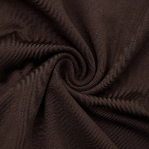 Detailed macro view of dark brown rib-knit fabric texture with soft vertical grain