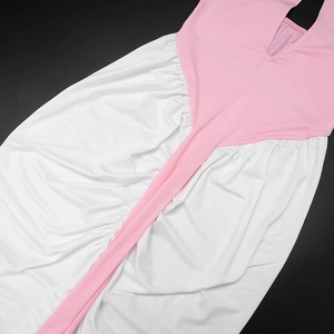 Detail of color-block halter dress with pink bodice and white pleated skirt texture