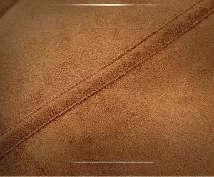 Detail of premium camel suede leather with durable double-stitched seam craftsmanship