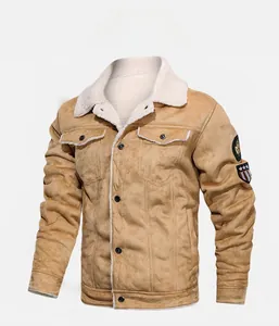 Detail of shearling-lined suede jacket featuring classic lapel and embroidered sleeve badge