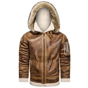 Macro view of distressed leather bomber jacket with thick white shearling fur lining