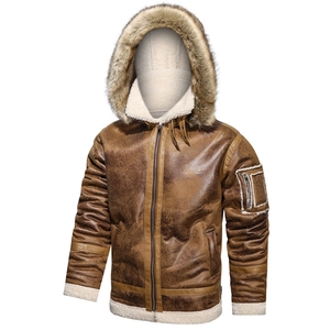 Close-up of brown leather bomber jacket with thick faux fur lining and warm hood