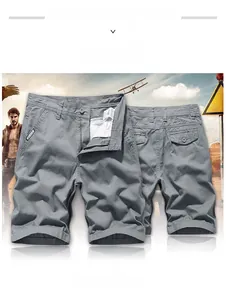 Detail showing multi-pocket grey cargo shorts in a rugged outdoor adventure setting