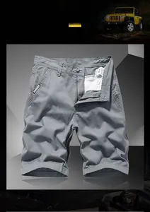 Detail of grey cotton cargo shorts with zipper fly and woven label on side pocket