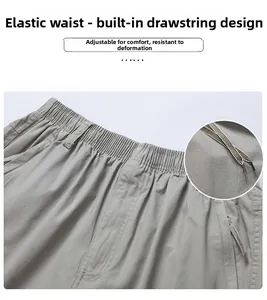 Detailed view of elastic waist with internal drawstring on men's cotton casual pants