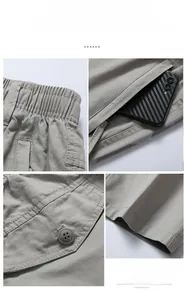 Detail view of khaki cotton cargo pants with elastic waist and reinforced stitching