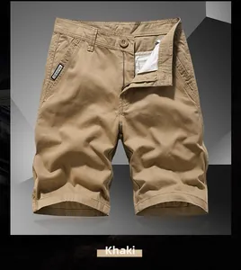 Detailed close-up of khaki cotton cargo shorts featuring a button waist and brand label
