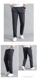Detailed views of dark grey cotton cargo pants showing elastic waist and straight-leg fit