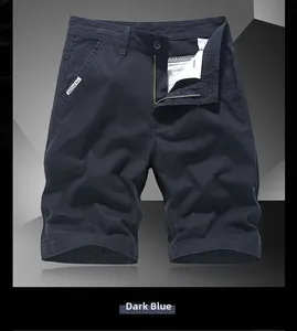 Detail of dark blue cotton shorts with metal zipper, button closure and FOR MEN woven label