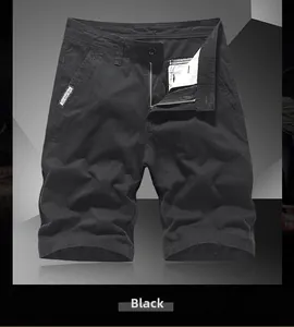 Detail of black cotton cargo shorts showing zipper fly and FOR MEN woven label