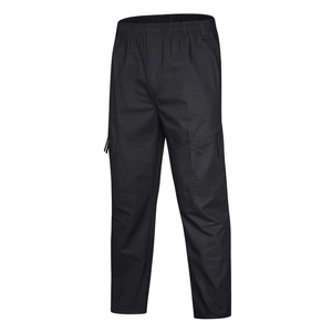 Detailed view of black cargo pants featuring elastic waist and functional side pockets