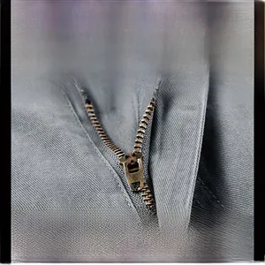 Detail view of durable metal zipper on dark gray twill cotton cargo shorts with sun protection