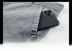 Detailed close-up of side pocket on grey cotton shorts with reinforced stitching