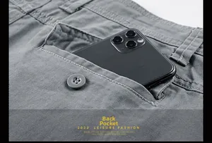 Detail view of cotton cargo shorts back pocket with button and large phone storage