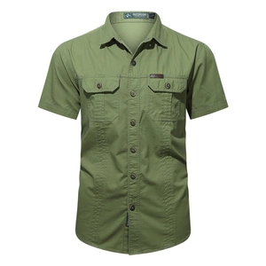 Detailed view of olive green short sleeve shirt with flap pockets and reinforced stitching