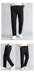 Detail view of black cargo pants featuring elastic waist with drawstrings and side pockets