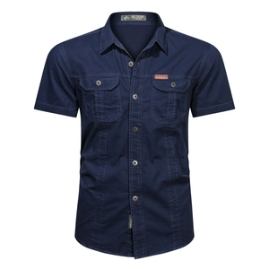 Detail of dark blue men's cargo shirt featuring dual chest pockets and leather label