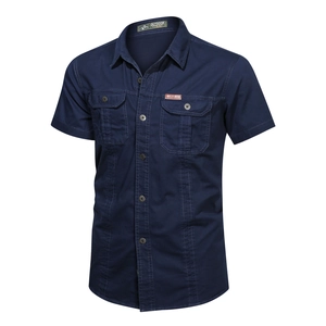 Detail view of navy blue short sleeve shirt showing chest pockets and collar brand label