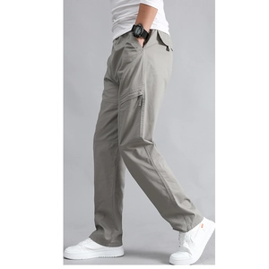 Men's loose fit multi-pocket cargo pants in light gray featuring durable cotton fabric
