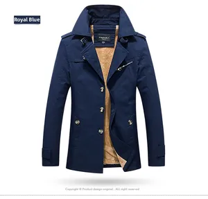 Detail of royal blue men jacket with warm yellow fleece lining and metal buttons