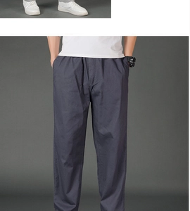 Detail view of men's dark gray straight cargo pants with elastic waist and side pockets