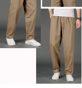 Detail of khaki casual straight-leg trousers featuring elastic waistband and twill texture