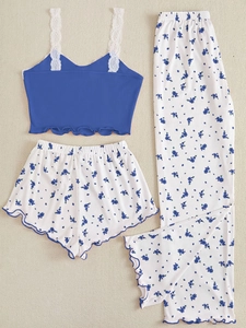 Close-up of blue ribbed camisole with lace straps and matching floral lounge pants set