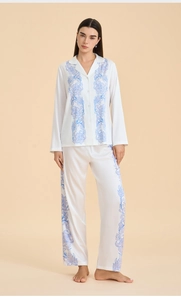 Full view of women's satin pajama set with blue paisley print on white fabric