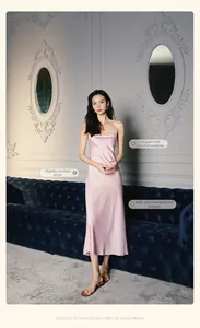 Detail of cowl neck design on a pale pink satin slip dress with elegant drapery