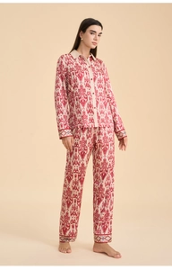 Close-up of ethnic ikat print satin pajamas set featuring long sleeve shirt and pants