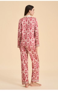 Rear view of ethnic ikat print satin pajama set showing elegant drape and floral hem details