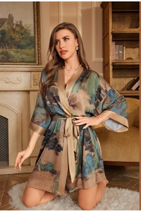 Detail of satin floral robe featuring landscape prints and loose kimono sleeves