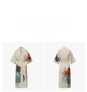 Detail of satin floral robe featuring red lotus print and elegant kimono sleeves