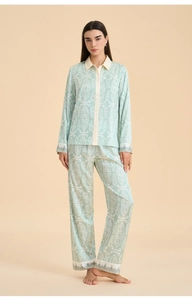 Full view of light green satin pajama set with ethnic patterns and long sleeves