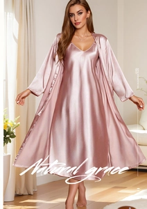 Detail of elegant pale pink satin nightgown set featuring a long robe and V-neck slip dress
