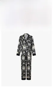 Detail of elegant black floral pajama set with smooth fabric texture and oriental motifs