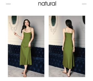 Detail of olive green satin nightgown with sleek spaghetti straps and draped neckline