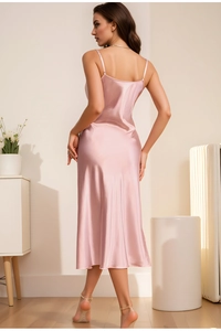 Detail of the open-back design and silky satin fabric on the light pink nightgown