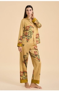 Detail of silk-like floral pajama set with elegant peony print and smooth golden finish