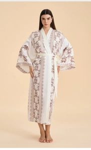 Detailed view of white floral print satin robe with wide sleeves and matching waist tie
