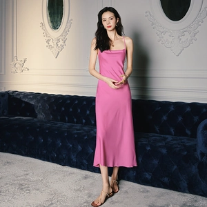 Detail of elegant magenta satin nightdress featuring cowl neck and thin straps