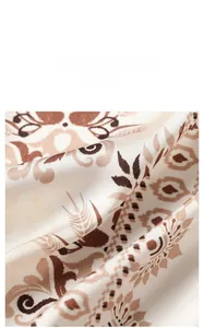 Detailed macro shot of vintage floral satin fabric with elegant drape and silky luster