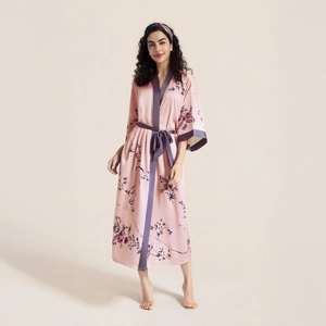 Floral print satin robe with three-quarter sleeves and dark grey trim on pink fabric