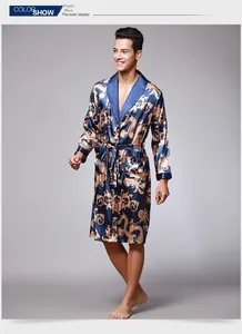 Detail of royal blue silk robe for men featuring gold dragon pattern and black cuffs