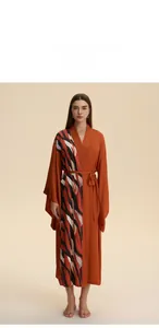 Front view of orange satin robe featuring abstract tiger pattern and belted waist design