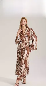 Detailed view of leopard print satin robe set with elegant silk-like draping fabric