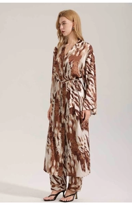 Detail view of luxurious leopard print satin loungewear robe and pants set for women