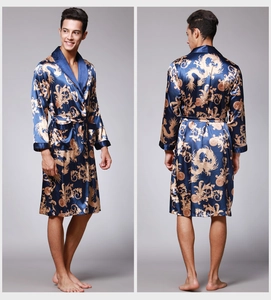 Detail of men's silk bathrobe featuring golden dragon patterns and a deep blue finish
