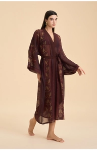 Detail of burgundy sheer robe with gold leaf pattern and kimono sleeves for women