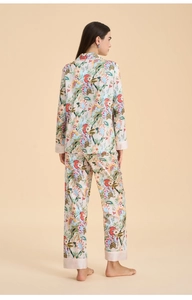 Rear view of floral satin pajama set featuring colorful botanical prints and pink cuffs